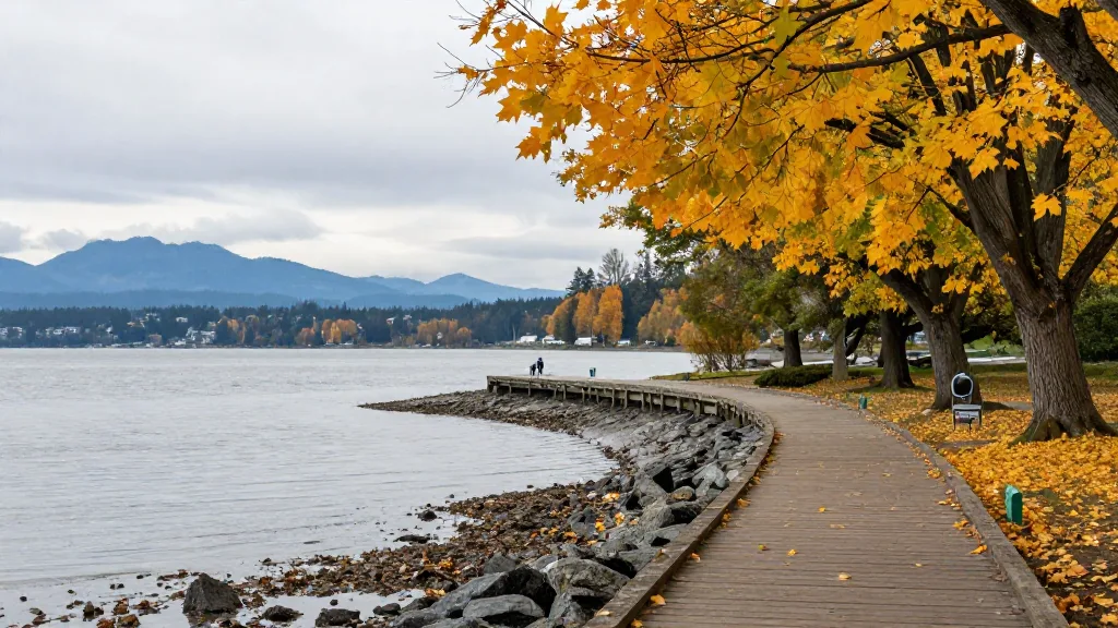 Shoreline boardwalk at Rocky Point Park with yellow leaves and tidal flats